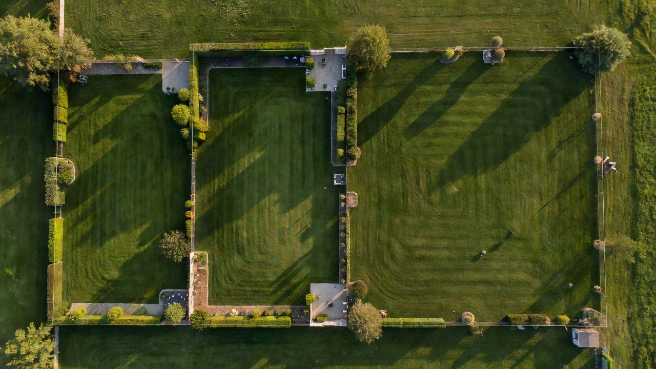 Aerial view showing three residential lawns of progressively larger sizes side by side