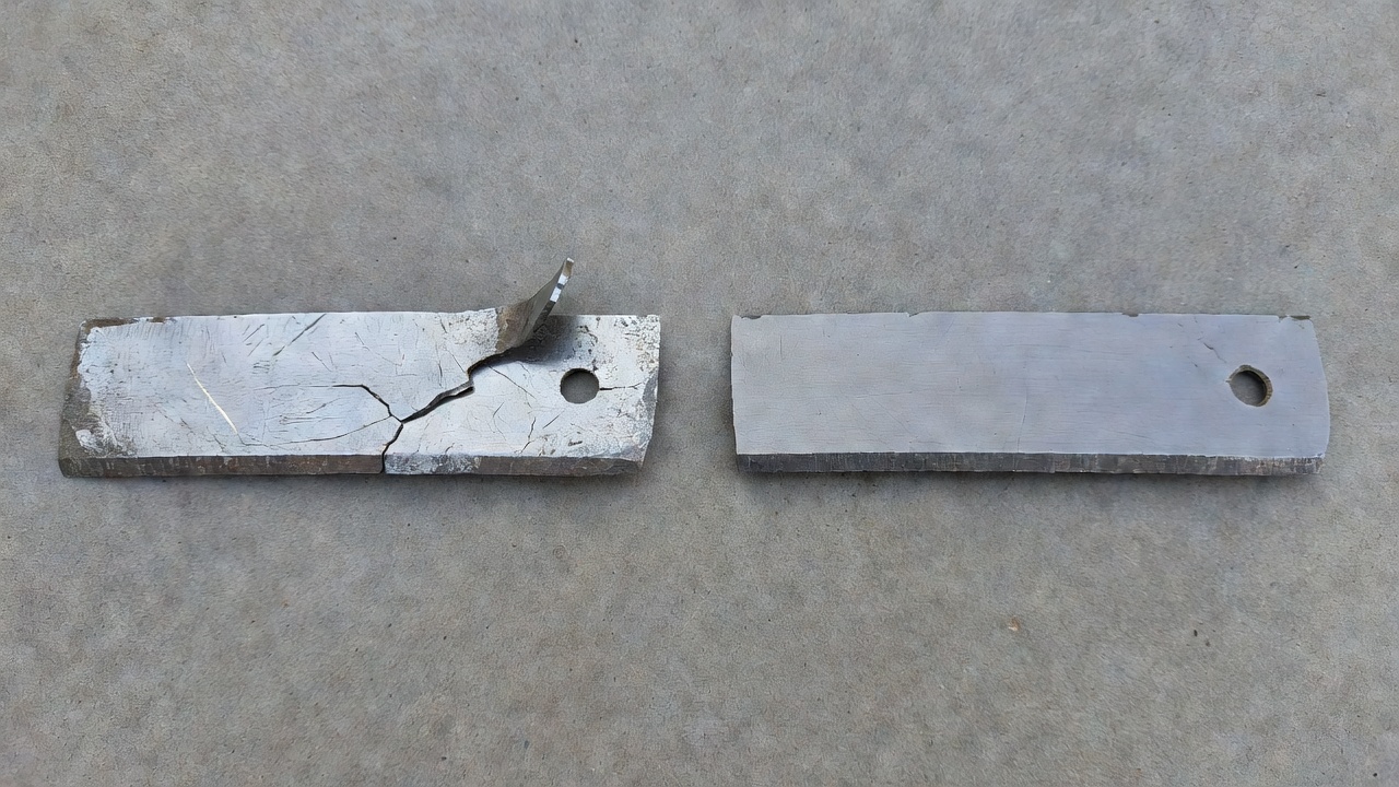How Do You Replace a Lawn Mower Blade? (Step-by-Step Safety Guide) Two lawn mower blades side by side showing blade damage requiring replacement versus a dull blade suitable for sharpening